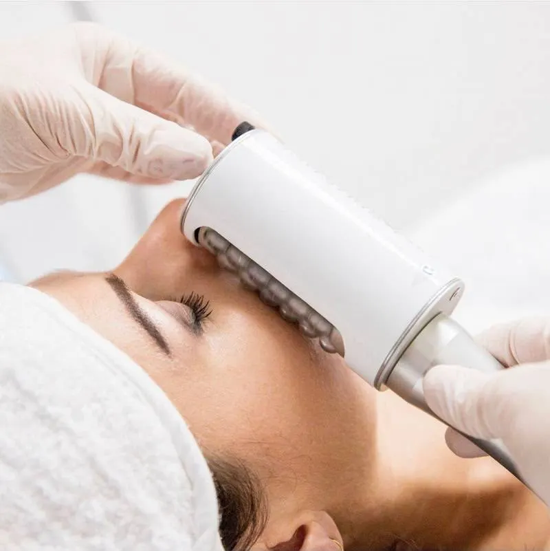 The small facial handpiece worked along the cheekbone